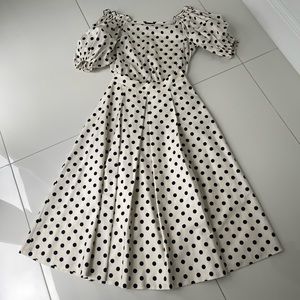 Set of:    Off the shoulder polka dot top (size L ) and skirt (size 44 )